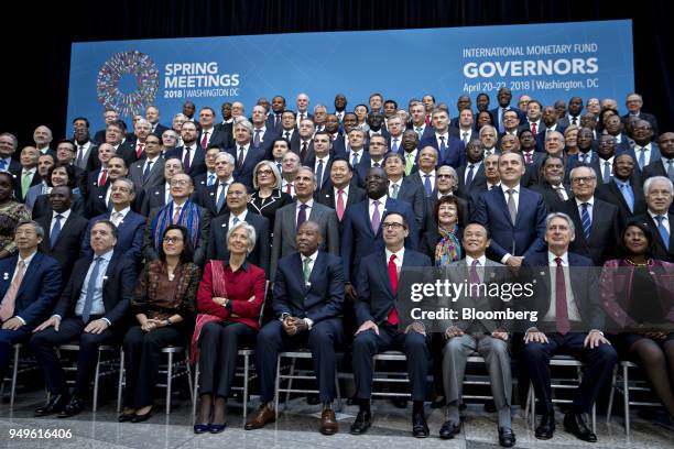 International Monetary Fund governors including Yi Gang, governor of the People's Bank of China , front row from left, Nicolas Dujovne, Argentina's...