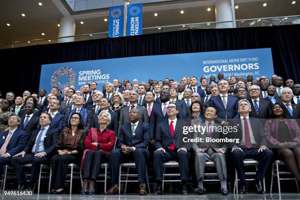 International Monetary Fund governors including Yi Gang, governor of the People's Bank of China , front row from left, Nicolas Dujovne, Argentina's...