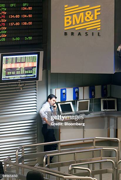 Trader works on an almost empty floor at the Brazilian Bolsa de Mercadorias e Futuros, or Brazilian Mercantile and Futures Exchange , in Sao Paulo,...