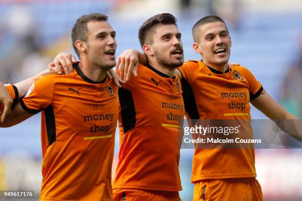 Leo Bonatini, Ruben Neves and Conor Coady of Wolverhampton Wanderers celebrate following the Sky Bet Championship match between Bolton Wanderers and...