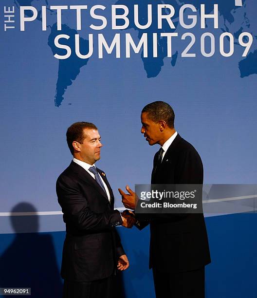 President Barack Obama, right, greets Dmitry Medvedev, president of Russia, at the welcoming dinner for Group of 20 leaders on day one of the G-20...