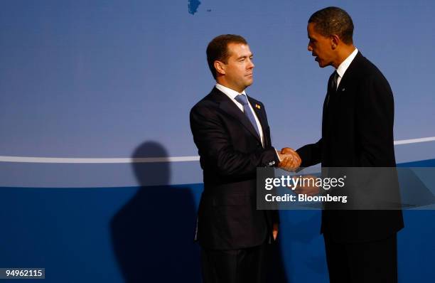 President Barack Obama, right, greets Dmitry Medvedev, president of Russia, at the welcoming dinner for Group of 20 leaders on day one of the G-20...