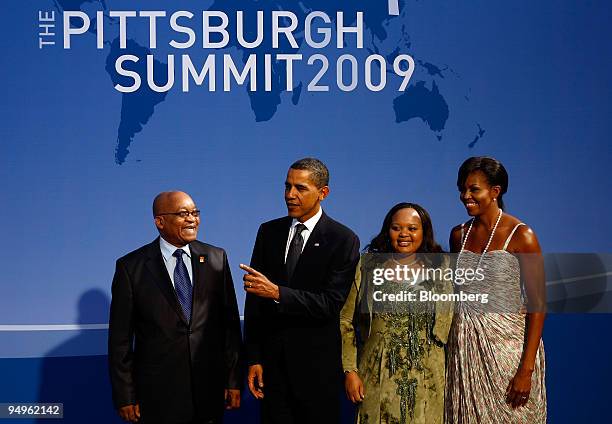 President Barack Obama, second from left, greets Jacob Zuma, president of South Africa, left, as U.S. First Lady Michelle Obama, right, and...