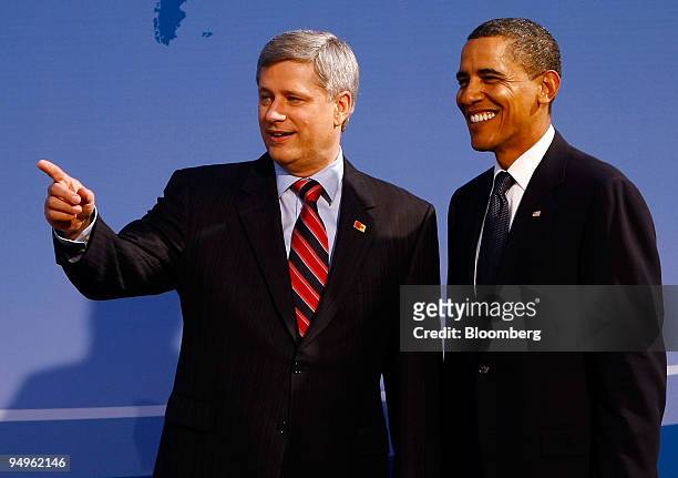 President Barack Obama, right, greets Stephen Harper, Canada's prime minister, at the welcoming dinner for Group of 20 leaders on day one of the G-20...