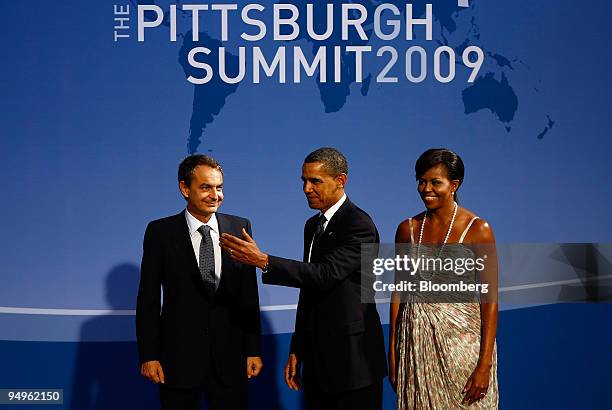 President Barack Obama, center, and with his wife, Michelle Obama, right, greet Jose Luis Rodriguez Zapatero, prime minister of Spain, to the...