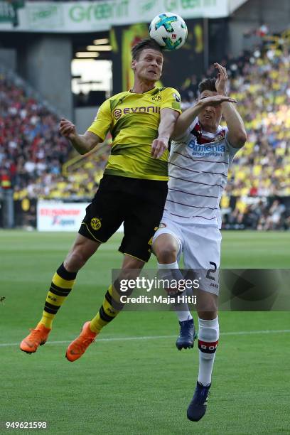 Lukasz Piszczek of Dortmund fights for the ball with Dominik Kohr of Bayer Leverkusen during the Bundesliga match between Borussia Dortmund and Bayer...