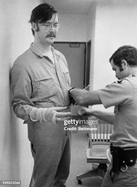 Edmund Kemper III is manacled by Santa Cruz Sheriff deputy Ron Atkinson following the 5th day of his trial where he is accused of killing eight...
