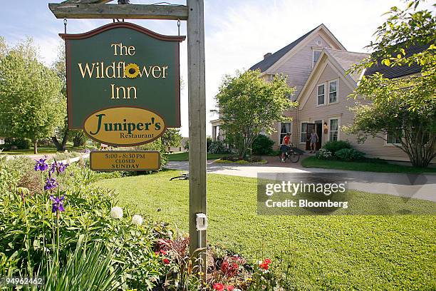 Biker talks to a guest outside the Wildflower Inn on Darling Hill Road, which offers direct access to the Kingdom Trails in East Burke, Vermont,...