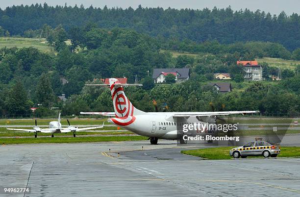 An aircraft from EuroLot, a subsidiary of Poland's national air carrier Polskie Linie Lotnicze LOT SA, taxi's on the runway at the John Paul II...