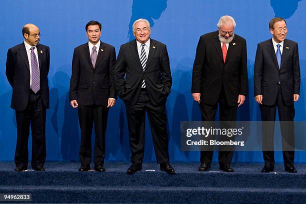 Dominique Strauss-Kahn, managing director of the International Monetary Fund , center, Ban Ki-Moon, secretary-general of the United Nations, right,...
