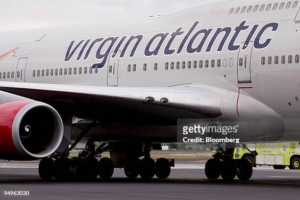 Virgin Atlantic Airways flight VS001, carrying Richard Branson, chairman of Virgin Group Ltd. To celebrate the airline's 25th anniversary by...