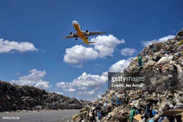 Plane on a descent through a garbage landfill on April 16, 2018 in Manila, Philippines. The Philippines has been ranked third on the list of the...
