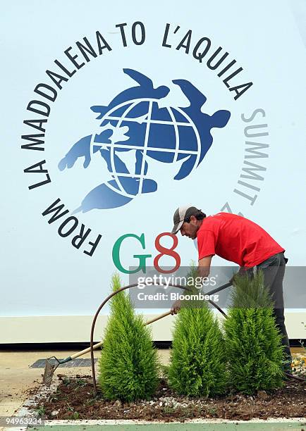 Gardener prepares the site at the Scuola della Guardia di Finanza the location for the G8 Summit in Italy, on Monday, July 6, 2009. Staunching the...