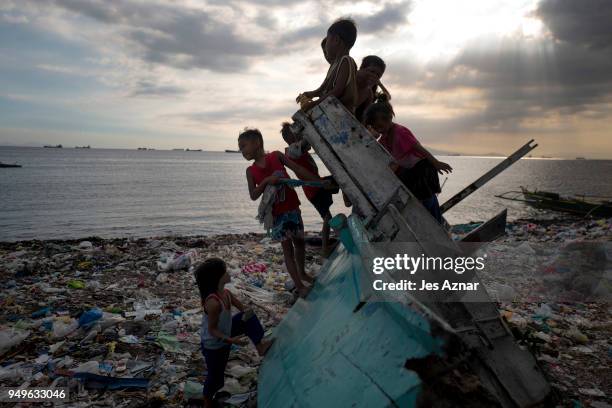 Children playing on a beach filled with plastic wastes on April 14, 2018 in Manila, Philippines. The Philippines has been ranked third on the list of...