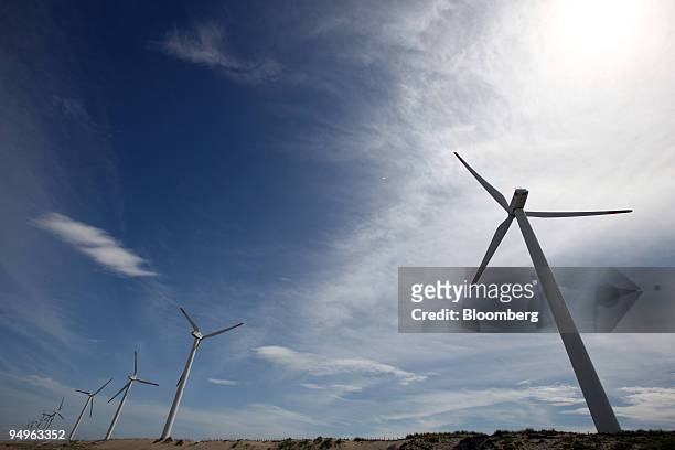 Wind turbines stand at the Hasaki Wind Farm in Kamisu City, Ibaraki Prefecture, Japan, on Tuesday, July 7, 2009. Prime Minister Taro Aso pledged on...
