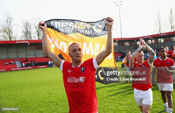 Richie Allen of Salford City celebrates on the pitch after winning the National League North championship in their second to last match between...