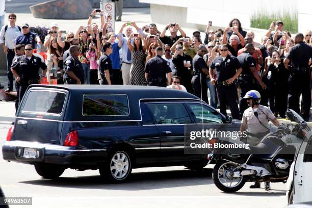 The hearse carrying the body of Michael Jackson arrives at the Staples Center where the public memorial for Jackson is being held in Los Angeles,...