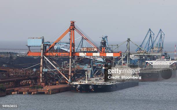 Dry-bulk ships are moored at a steel plant in Kamisu city, Ibaraki prefecture, Japan, on Tuesday, July 7, 2009. Prime Minister Taro Aso pledged on...