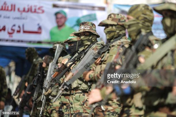 Members of Izz ad-Din al-Qassam Brigades, which is the military wing of the Palestinian Hamas organization, stand guard during a funeral ceremony of...