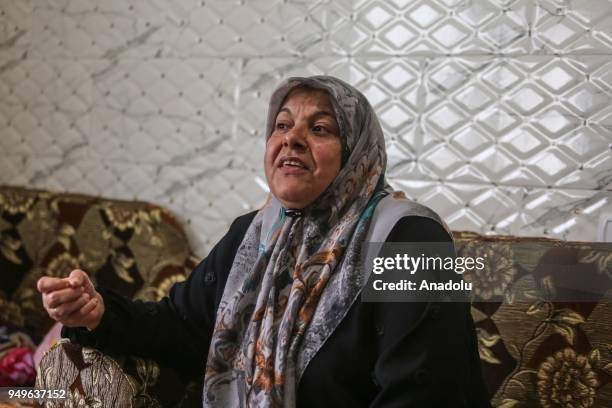 Fatima al-Batsh, mother of Fadi al-Batsh, who was shot dead in Kuala Lumpur, attends his son's funeral ceremony, is seen during an interview as she...