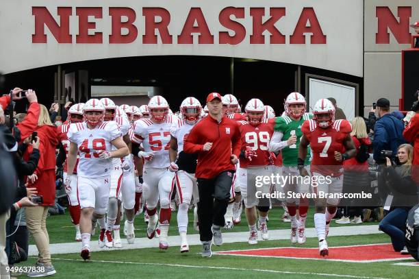 Head Coach Scott Frost of the Nebraska Cornhuskers leads the team on the field before the Spring game at Memorial Stadium on April 21, 2018 in...