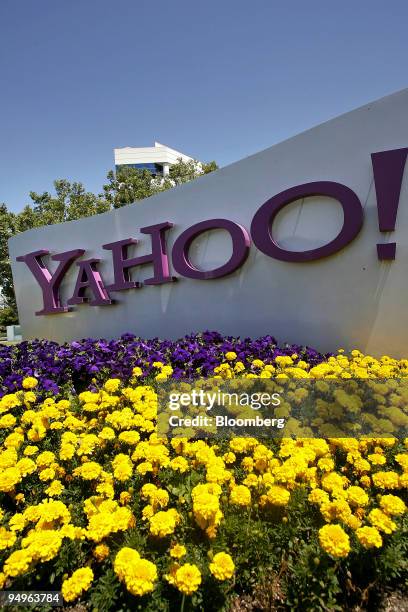 Flowers grow under a Yahoo sign outside the company's offices in Santa Clara, California, U.S., on Thursday, June 25, 2009. Yahoo! Inc. Plans to...