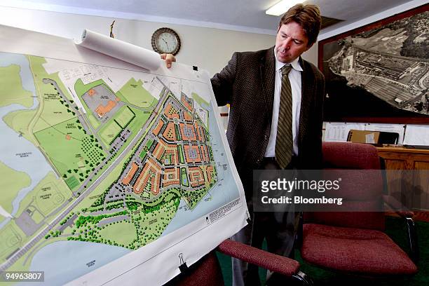 Anthony Giaccio, Sleepy Hollow's village administrator, shows a development proposal on the grounds of a former General Motors Corp. Chevrolet plant...