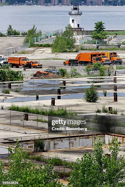 Municipality trucks are parked on the grounds of a former General Motors Corp. Chevrolet plant in Sleepy Hollow, New York, U.S., on Thursday, June...