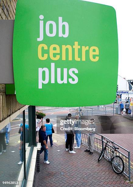 Job seekers stand outside a job centre in Grays, U.K, on Friday, June 26, 2009. U.K. Unemployment claims rose the least in a year in June, adding to...