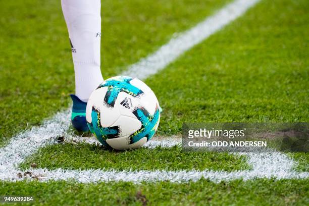 Bayern Munich's German forward Thomas Mueller places the ball for a corner kick during the German first division Bundesliga football match between...