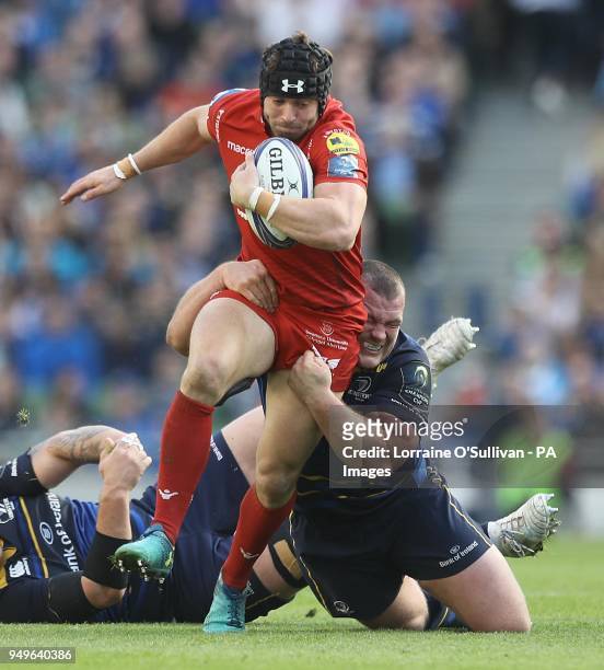 Leinster's Jack McGrath tackles Leigh Halfpennyof Scarlets during the European Champions Cup semi-final match at the Aviva Stadium, Dublin.
