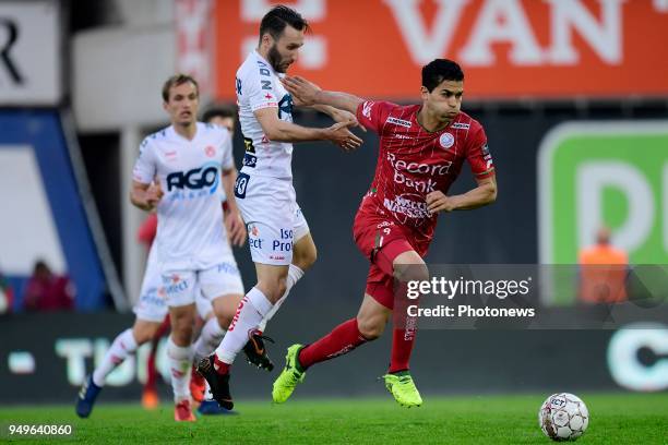 Hamdi Harbaoui forward of SV Zulte Waregem holds off the challenge of Idir Ouali forward of KV Kortrijk during the Jupiler Pro League Play - Off 2A...