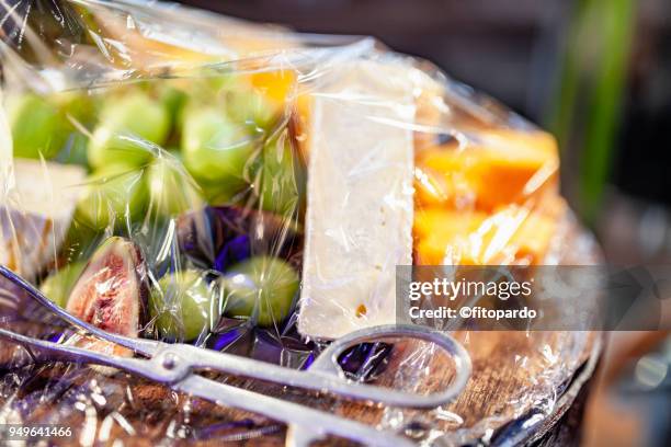 wrapped tray of fruits and cheese - prosciutto wrapped stock pictures, royalty-free photos & images