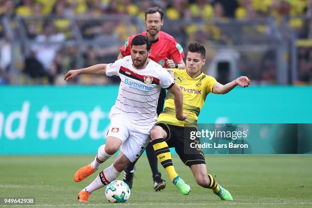 Kevin Volland of Bayer Leverkusen fights for th eball with Julian Weigl of Dortmund during the Bundesliga match between Borussia Dortmund and Bayer...
