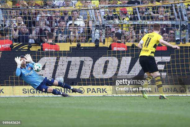 Marco Reus of Dortmund sees his penalty kick saved by goalkeeper Ramazan Oezcan of Bayer Leverkusen during the Bundesliga match between Borussia...