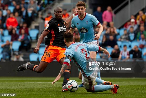 Geoffrey Kondogbia of Valencia CF competes for the ball with Hugo Mallo of Celta de Vigo during the La Liga match between Celta de Vigo and Valencia...