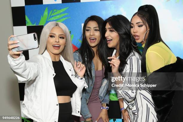Isabel Bedoya and Melly Sanchez pose with fans during a Meet & Greet during Beautycon Festival NYC 2018 - Day 1 at Jacob Javits Center on April 21,...