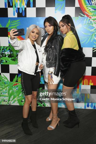 Isabel Bedoya and Melly Sanchez pose with fans during a Meet & Greet during Beautycon Festival NYC 2018 - Day 1 at Jacob Javits Center on April 21,...