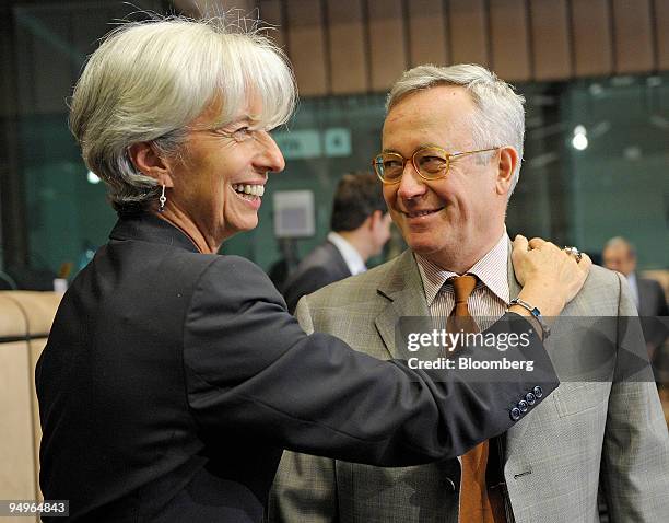 Christine Lagarde, France's finance minister, left, greets Giulio Tremonti, Italy's finance minister, at the Eurogroup finance ministers meeting in...