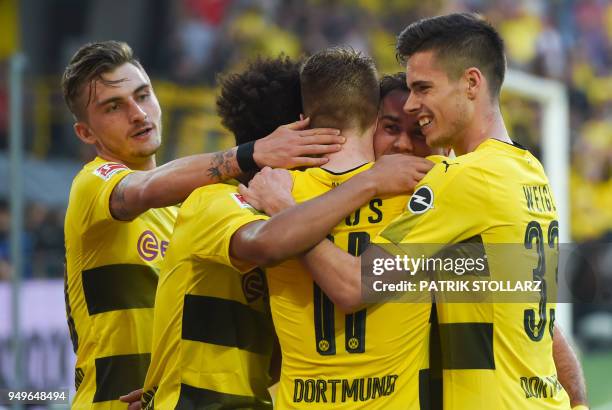 Dortmund's players celebrate after scoring during the German first division Bundesliga football match Borussia Dortmund vs Bayer Leverkusen, in...