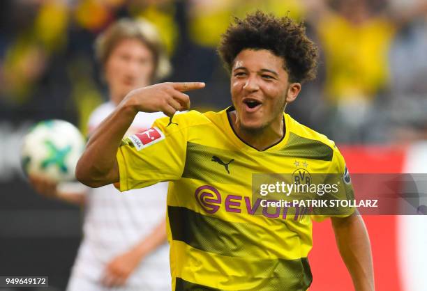 Dortmund's English midfielder Jadon Sancho celebrates after scoring during the German first division Bundesliga football match Borussia Dortmund vs...