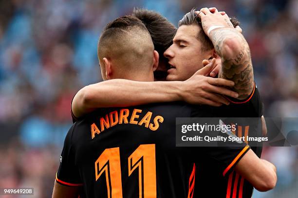 Santi Mina of Valencia CF celebrates with his team-mates after scoring his team's first goal during the La Liga match between Celta de Vigo and...