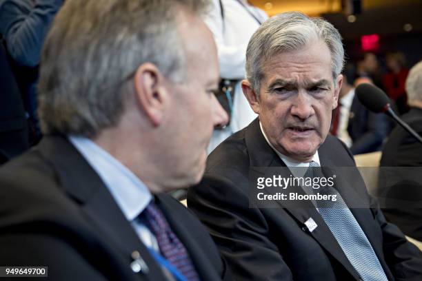 Jerome Powell, chairman of the U.S. Federal Reserve, right, talks to Stephen Poloz, governor of the Bank of Canada, during the International Monetary...