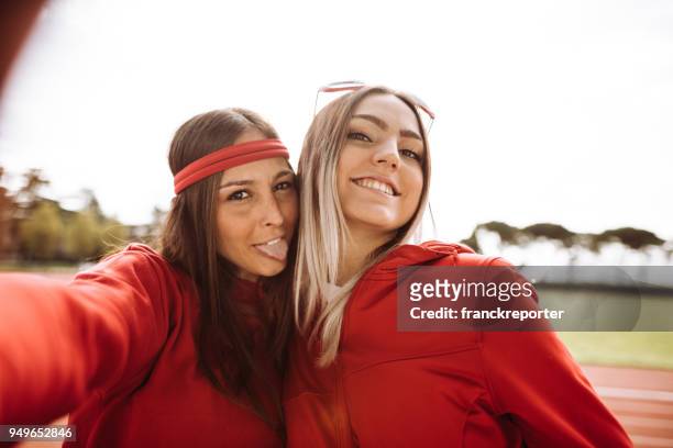 friends have fun at the stadium - groupie stock pictures, royalty-free photos & images