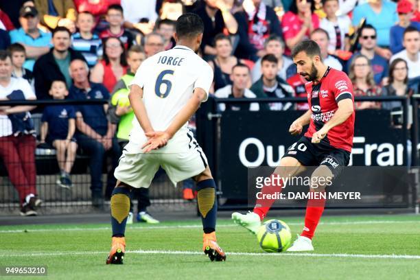 Guingamp's French midfielder Nicolas Benezet vies with Monaco's Brazilian defender Jorge during the French L1 football match Guingamp against Monaco...