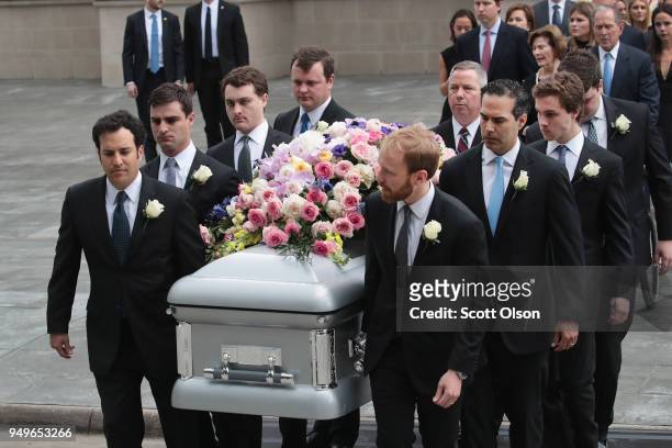 The coffin of former first lady Barbara Bush is carried from St. Martin's Episcopal Church following her funeral service on April 21, 2018 in...