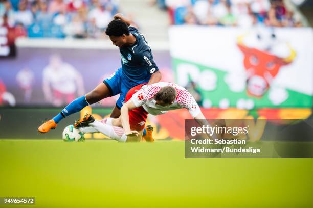 Serge Gnabry of Hoffenheim and Lukas Klostermann of Leipzig compete for the ball during the Bundesliga match between RB Leipzig and TSG 1899...