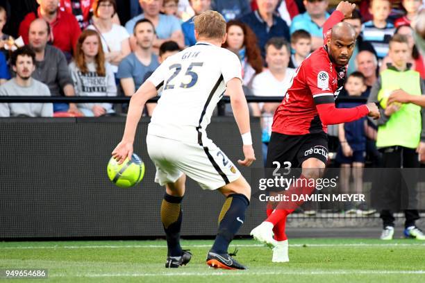 Guingamp's French forward Jimmy Briand kicks the ball past Monaco's Polish defender Kamil Glik during the French L1 football match Guingamp against...