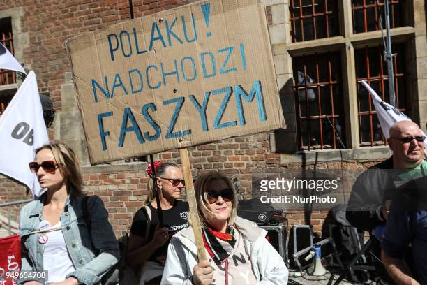 Woman with banner that says fascism is comming is seen in Gdansk, Poland on 21 April 2018 Houndreds of people gathered in front of old City Hall in...