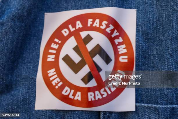 Crossed swastika with slogan &quot;Not for fascism, not for racism&quot; is seen in Gdansk, Poland on 21 April 2018 Houndreds of people gathered in...